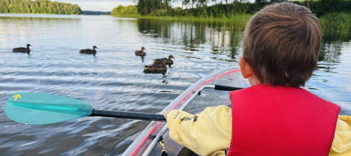 Transparent boats in Plateliai with kids