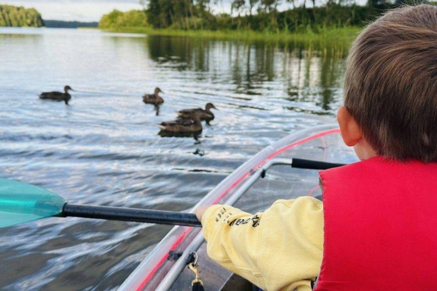 Transparent boats in Plateliai with kids